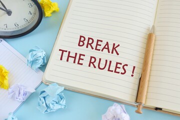 Writing note showing Break The Rules. Business photo showcasing To do something against formal rules and restrictions.Notebook with text Break the rules on bright blue background