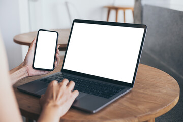 computer screen,cell phone blank mockup.hand woman work using laptop texting mobile. with white background for advertising,contact business search information on desk in cafe.marketing,design
