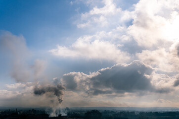 Fototapeta premium Chimney of a ceramic industrial oven drawing a black smoke