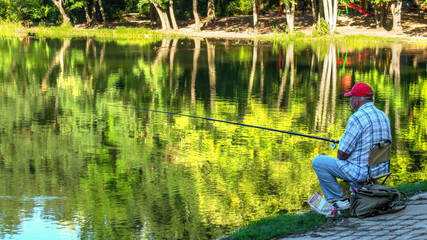 A fisherman catching a fish in Chisinau, Moldova