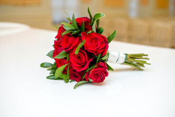 
A wedding bouquet of red roses lies