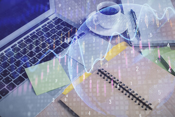 Multi exposure of forex graph drawing and desktop with coffee and items on table background. Concept of financial market trading