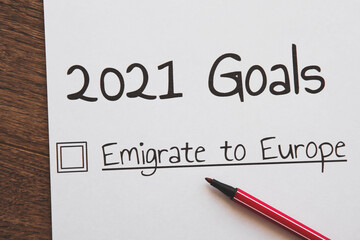 planner of goals and plans for 2021, a sheet of paper with the inscription emigrate to Europe from to do list