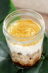 granola, coconut mousse, dates and turmeric powder healthy vegan dessert