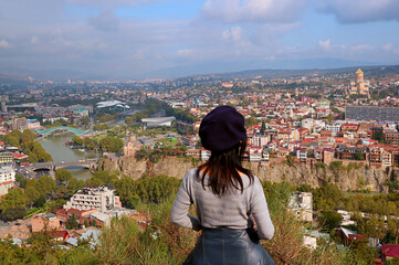 Woman Enjoy Stunning Aerial View with Many of Iconic Landmarks of Tbilisi, the Capital City of Georgia