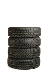 Fototapeta na wymiar Four black tires isolated on white background