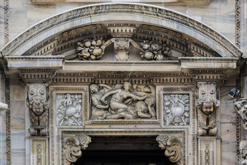 Architectural fragment of Milan Cathedral (Duomo di Milano, 1386), dedicated to St Mary of the Nativity (Santa Maria Nascente), with Gothic and Lombard Romanesque style. Milan, Italy.