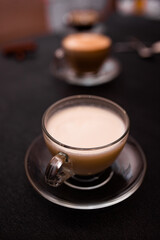 A cup of hot coffee latte cappuccino with cinnamon
