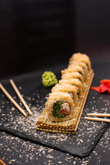 sushi hot rolls on black background dish japanese cuisine