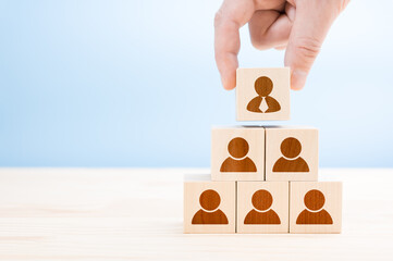Management hierarchy pyramid with wooden cubes. Human resources, corporate hierarchy concept and...