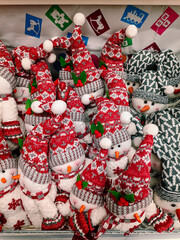 Fototapeta na wymiar Plush toys - Christmas snowmen in red hats.