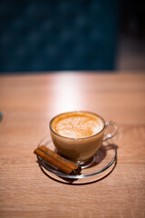 A cup of hot coffee latte cappuccino with cinnamon