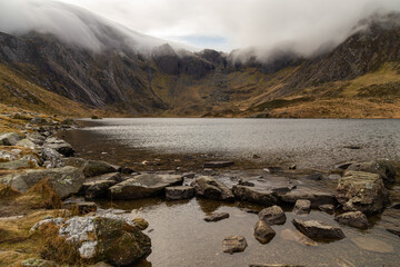 Cwm Idwal, Glyderau mountain range, Snowdonia. A wintry January day with clouds sitting on top of the mountain range.