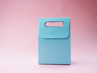 blue empty gift bag on pink background, for your design