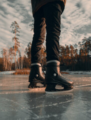 Ice skating on frozen lake man caucasian