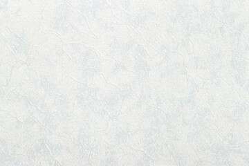 Abstract light texture with blue, gray and white stripes and streaks, close-up. The surface of the paper and wallpaper