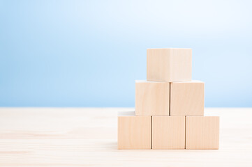 mockup image. pyramid of blank wooden cubes for icons, symbols, or text. Business and design concept