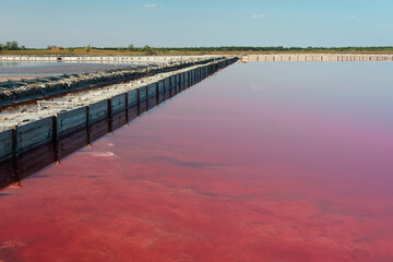 Fototapeta premium Pink salt lake. Production of pink salt. Soft selective focus.