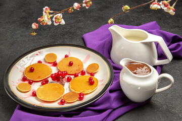Obraz na płótnie Canvas front view yummy little pancakes with choco syrup on dark background milk dessert sweet