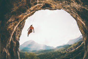 Rock climber hanging on a rope.