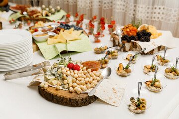 Table with different sweets food and snacks on event catering. Buffet snack