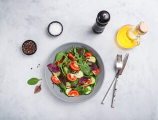 Healthy fresh salad of vegetable cucumber, tomato, spinach, arugula
