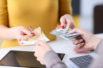 Transfer of currency from hand to hand at workplace