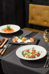 dining table food set with appetizer and drinks in restaurant