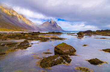  Incredible summer day on Stokksnes headland. Beautiful  reflection of Vestrahorn (Batman) mountaine in the water during low tide. Southeastern Iceland, Europe. Visit Iceland. Beauty world.