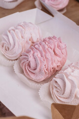 Pink and white marshmallows in gift box. Cozy homemade dessert holidays