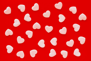 Valentine's Day red background with pink hearts. Valentine's Day pattern, Mother's Day, March 8 greeting card.