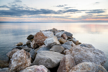 Fototapeta na wymiar Rocks on the Aegean sea coast in Skala Fourkas, Greece