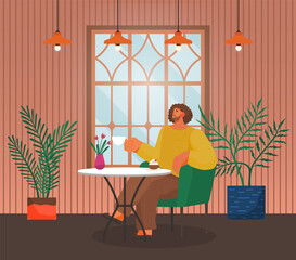 Young man enjoy of drinking tea, coffee sitting at table in cafe, restaurant, home. Relax time. Keep calm and enjoy free time. Interior with decoration, vase with flowers, houseplant. Time to chill