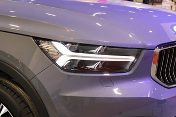 Detailing the headlights of modern luxury sports cars