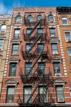 Brooklyn buildings. Exposed bricks and fire escapes.