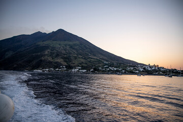 Lighthouse overlooking the sea, on an old inactive volcano, called Strombolicchio. The sunset...