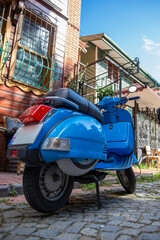 Naklejka na ściany i meble Blue vintage scooter in Istanbul, Turkey