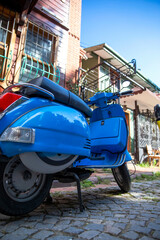 Naklejka na ściany i meble Blue vintage scooter in Istanbul, Turkey