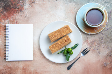top view yummy cake slices honey cake with tea on light background pie cake biscuits sweet