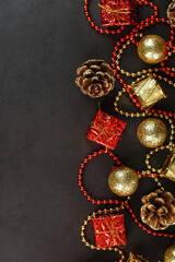Christmas or New Years dark background with red and gold decorations for the Christmas tree with free space