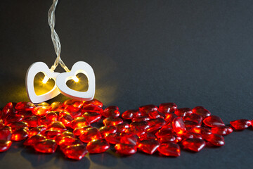 Two white hearts burning with golden light are connected together-a concept for Valentine's Day,...