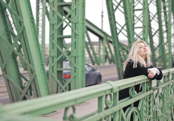 young woman on a bridge