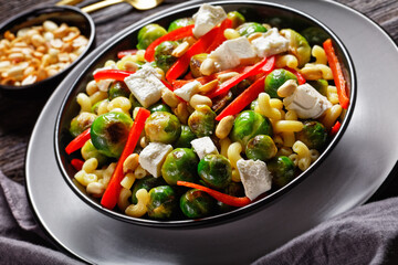 macaroni salad with broccoli sprouts in bowl