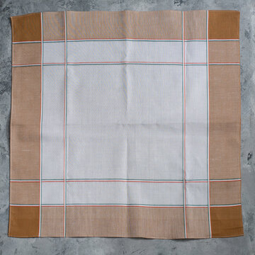 White brown handkerchief for men on grey background.