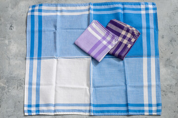 Set of colorful blue violet Handkerchiefs for men on grey background.