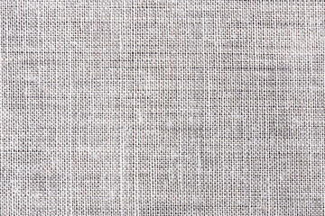 White fabric background. Grey canvas texture. Bright textile material background. Gray fiber pattern. Checkered textile texture.