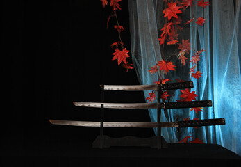 Japanese sword Katana, wakizashi and tanto on stand. on red autumn leaves background.