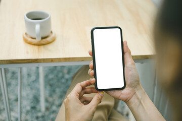 cell phone blank white screen mockup.woman hand holding texting using mobile on desk at office.background empty space for advertise.work people contact marketing business,technology