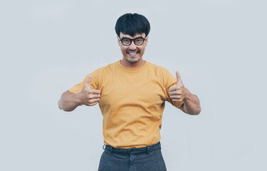 Naklejka premium adult asian man.young male wear eye glasses.posing smiling look excited surprised thinking positive happy joy life.empty,copy space for text advertising.white background.attractive fashion people