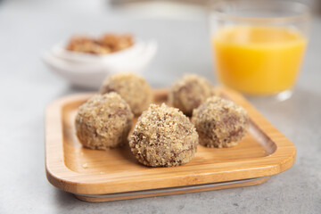 Cake balls with almonds, biscuits and orange juice